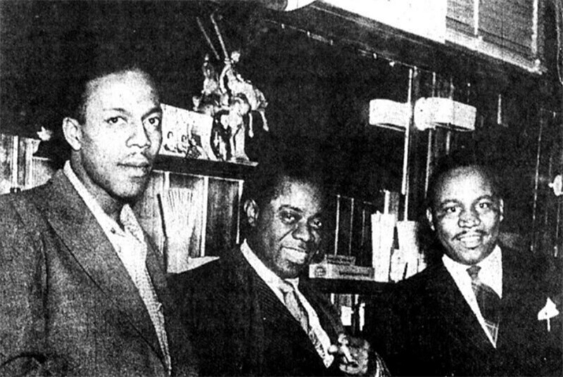 Jazz muscian, Louis Armstrong, with the owners of the Dude Ranch