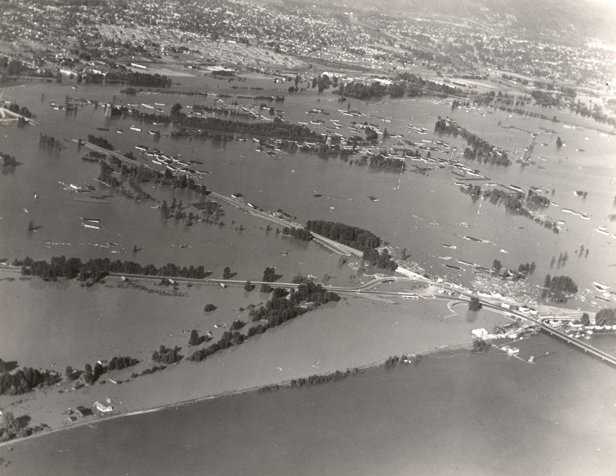 Black and white aerial photograph of extreme flooding at Vanport. Only trees and roadways are visible above water. Dec. 31, 1948.