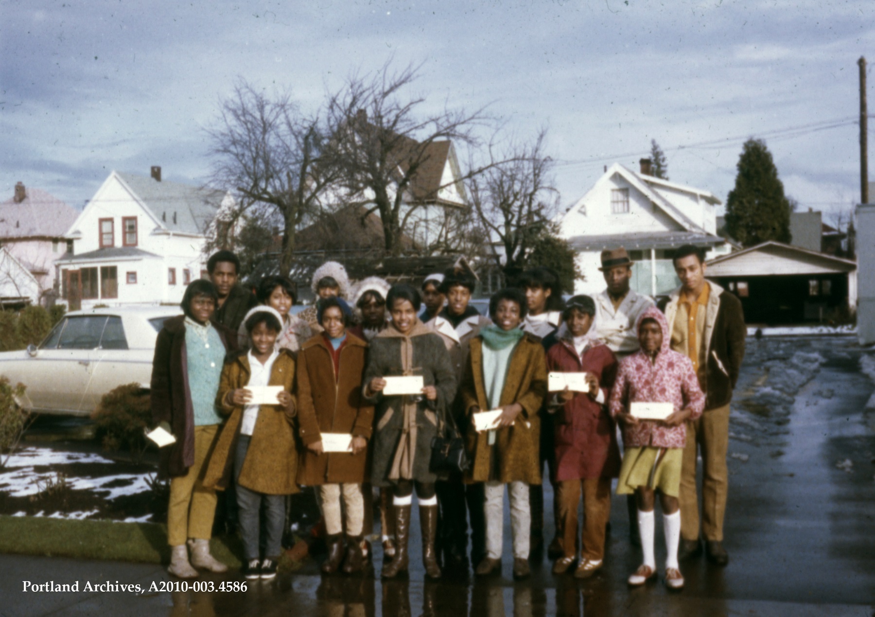 A group of Portland residents pose for a photo outside during an Emeralds and Imperials general neighborhood meeting. April 1968.
